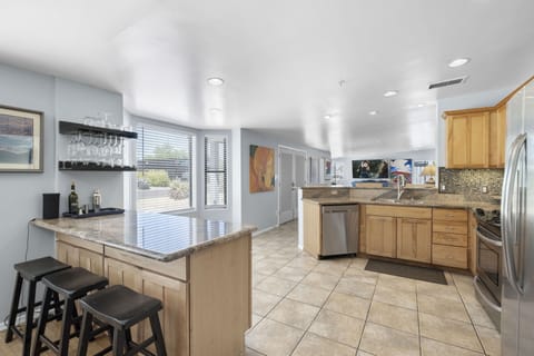 View into kitchen with with barware for your favorite cocktail.