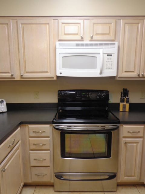 Full kitchen with coffee maker.