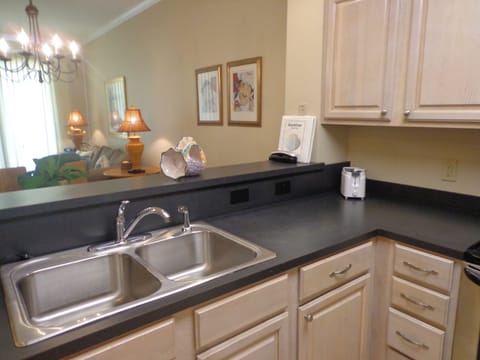 Full kitchen with coffee maker.