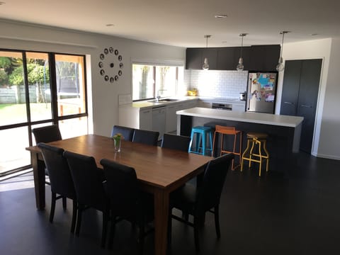 Kitchen/Dining with flow onto Deck and back yard