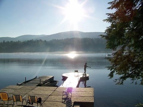 View of Dock area showing lakeside patio, swim and boat docks, steps into water