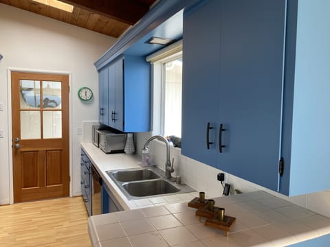 Fully stocked kitchen with new oven, refrigerator and microwave