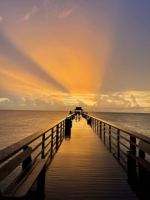 Steps to the famous Naples Pier and white sand beach