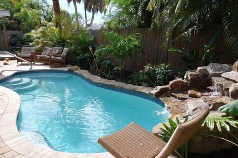 View of pool from waterfall grotto hangout area toward deck