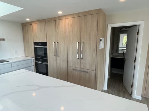 Miele steam oven, conventional oven, and built-in refrigerator.