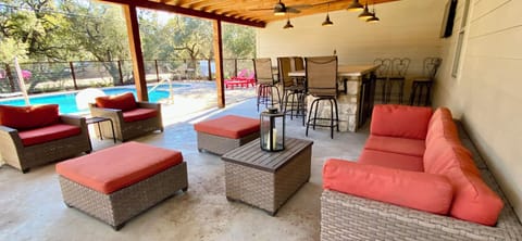 Casa Floerke - Poolside Cabana with furniture, bar, sink, outdoor shower, TV, lighting.