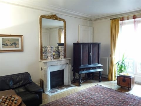 Salon w/Haussman Elegance-marble fireplace, ceiling mouldings, parquet floors.