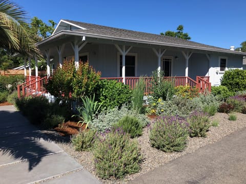 Front & side entrances, additional porch areas, and landscaped surround