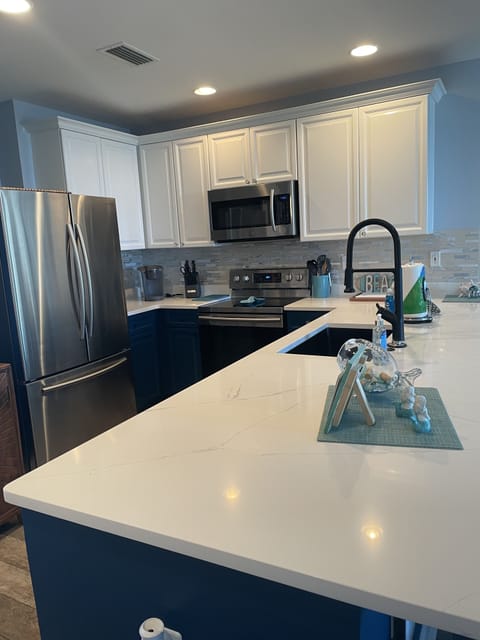 REFRESHED KITCHEN, NEW COUNTER TOPS/SINK AND PAINTED CABINETS. 