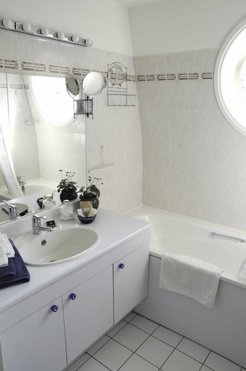 Ensuite bathroom with shower in the bath. Your private toilet is separate.