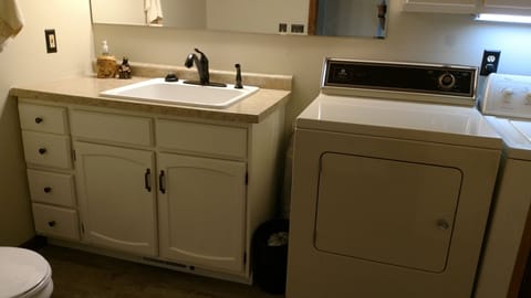 Bathroom on main level with waster and dryer