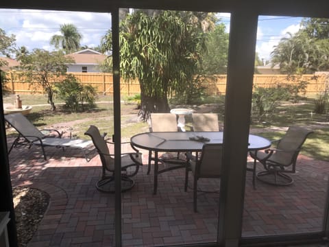 Parkview room opens to large private yard, set up for BBQ, w/table & grill.