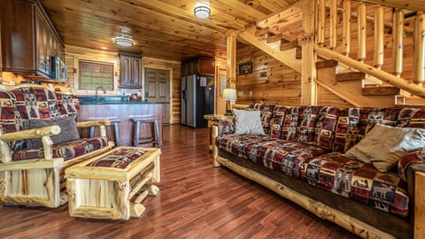 Main level living room next to kitchen