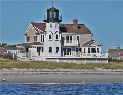 View from water.  The beach is beautiful white sand and the water is warm!