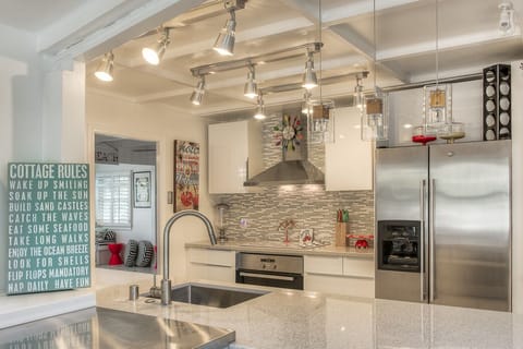 Completely new kitchen with microwave, oven, dishwasher,refrigerator with ice maker.  Quartz counter tops through out-stunning! Well stocked with pots, pans, dishes etc. Everything to make you feel at home.