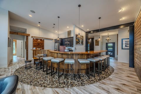 Stylish kitchen bar with rustic accents, ideal for hosting and entertaining.