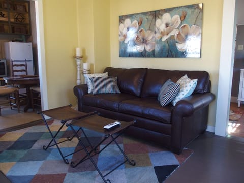 kitchen is to the left and the bedroom is to the right