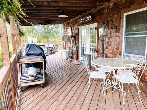 Walk out covered deck with seating for 8.