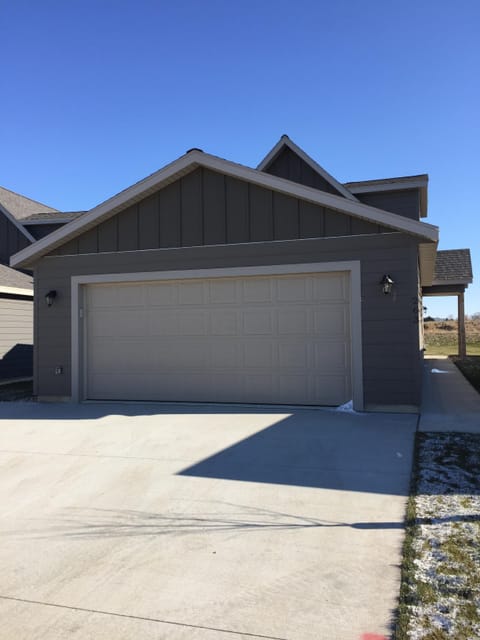 Exterior Front View of Double Car Garage and Large Driveway
