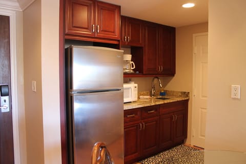 Kitchenette with full size fridge, sink, microwave, coffee maker, blender, etc.!