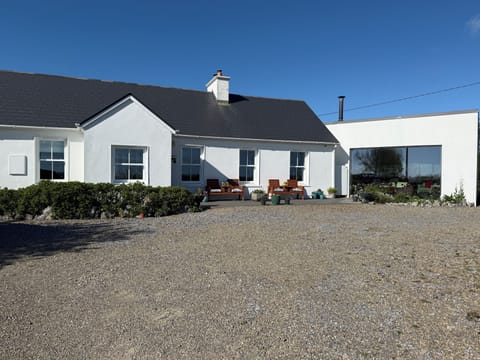 Sit outside and admire the view of the Cliffs of Moher, Atlantic Ocean, gardens.