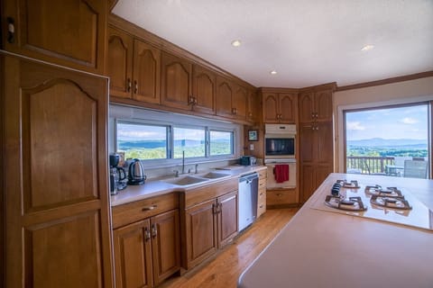 The Kitchen with sliding doors onto the deck.  Views from every direction