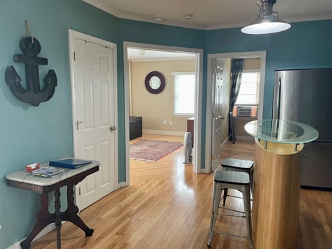 Kitchen, bathroom door, view dining room (coming), and door to second bedroom