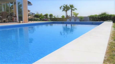 Large private pool in the gardens next to the villa