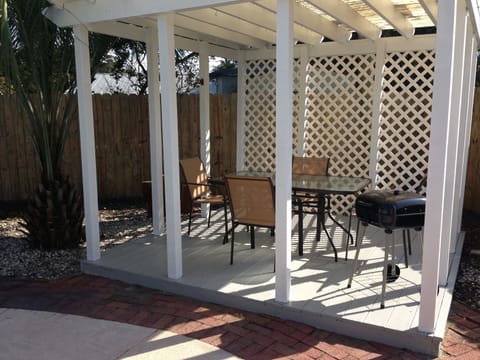 Enjoy outdoor dining under a covered gazebo plus access to a charcoal grill.