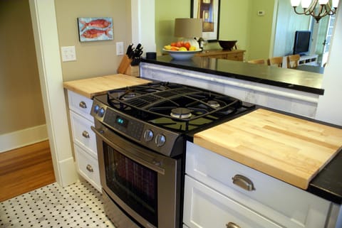 Gas range with roll out drawers for ease locating pans.