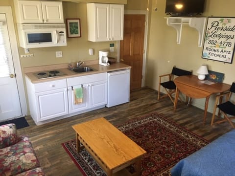 Kitchenette with min-fridge, sink, cook-top & microwave.