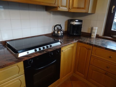 Fully equipped kitchen with bean to cup coffee machine.