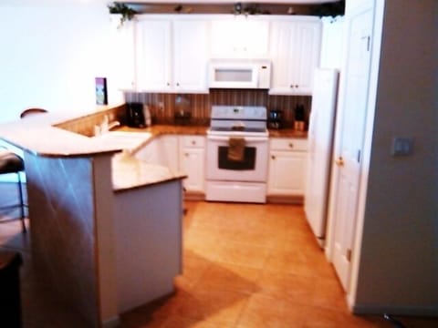 Kitchen with Dishwasher, Icemaking Side by Side Refrigerator