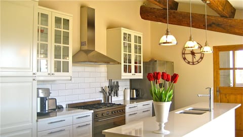 Kitchen.  Laundry/office, plus a 3rd WC through wooden door shown in photo.
