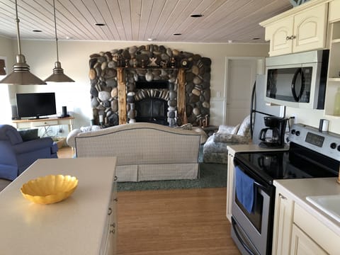 LIVING ROOM FIREPLACE FROM THE KITCHEN