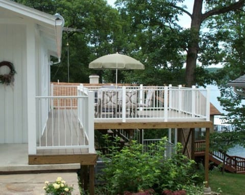 View of Outside Deck with Patio Seating for 6. Includes a Large Gas Grill.