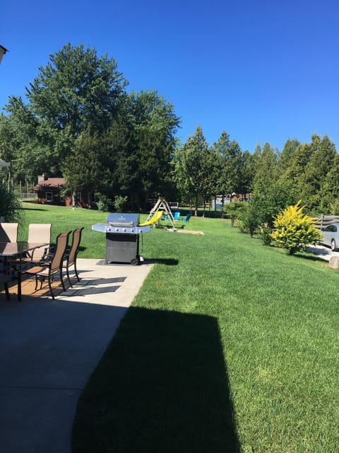 Yard with Pool and Clubhouse just beyond trees