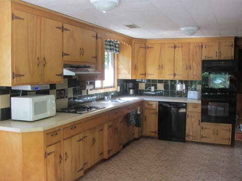 Kitchen - Main Level, Faces Woods, Double Oven, Dishwasher, Microwave, Fridge.