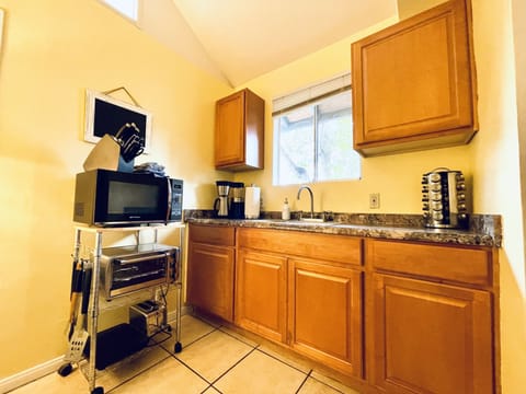 Kitchen with full size frig, toaster oven, microwv, hot plate, crock pot, grill