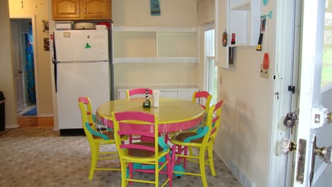 Dining area with plenty of wall shelving for storage. Extra table leaves avail.