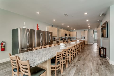 Extra large dining with seating for 36, 3 refrigerators, 2 stoves, 4 dishwashers