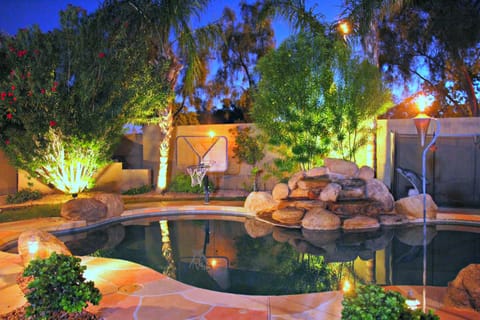 Relax in your private,  fenced in heated pool with a waterfall!