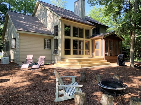 Rear view of the house, deck and backyard.