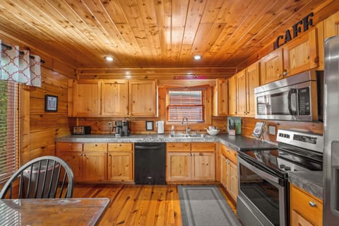 Fully stocked kitchen with concrete counter tops. Ready for all your meals.