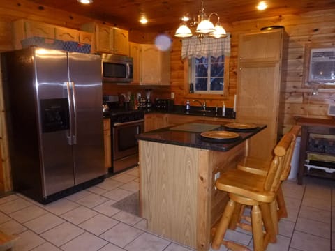 Kitchen area with all pots, pans, dishes, silverware, coffee maker, etc.