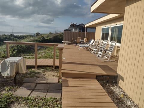 Oceanfront gathering with rockers & chaises.