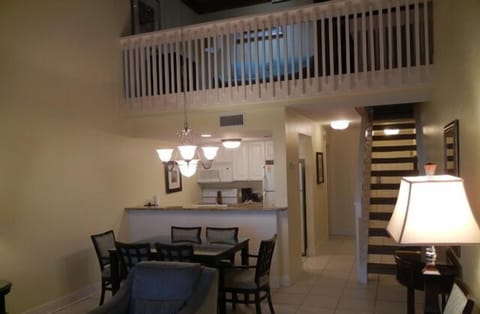 Looking up into the loft area from the living room