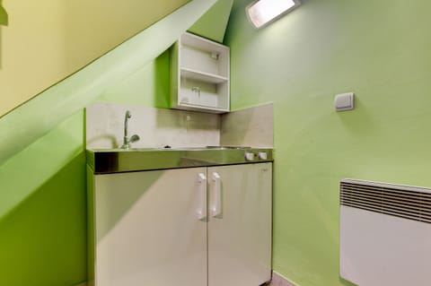 Kitchenette is Set in the Corner on the Lower Floor with Basic Amenities