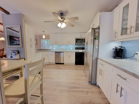 New Kitchen with white shaker cabinets and beautiful granite countertops.