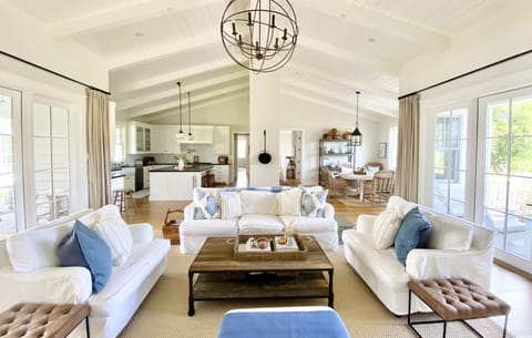 Great Room off kitchen with fireplace, TV, & lots of board games. 